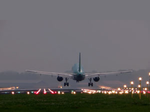 Plane Landing At Airport Background